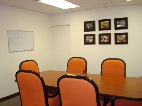 The conference table and white board provide space for meeting and brainstorming
